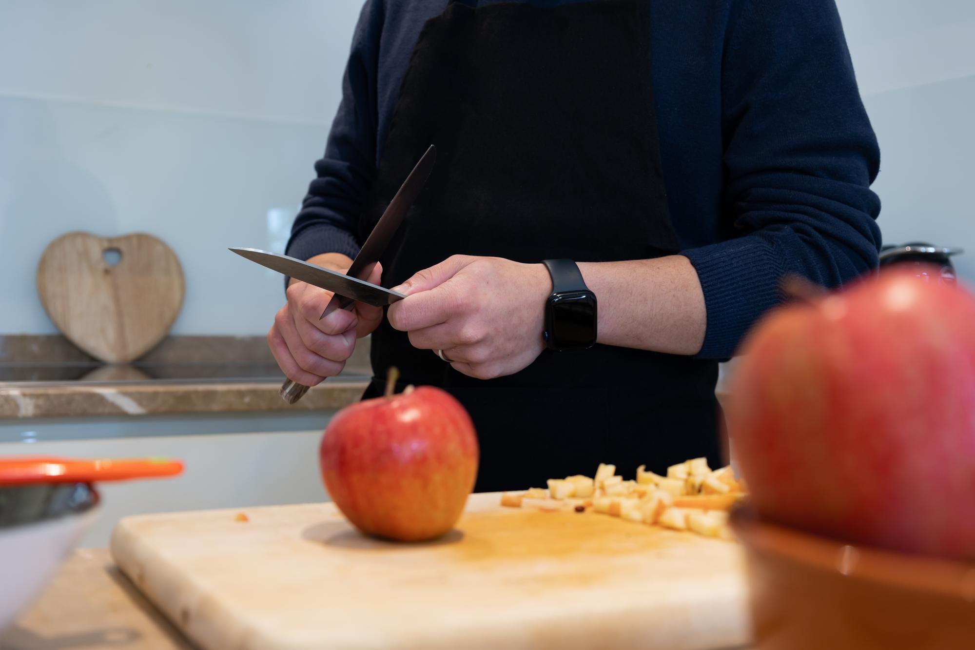 Instructor demonstrating knife skills to students